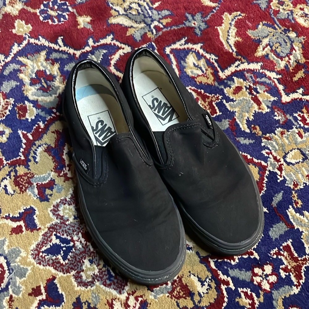 All black vans slip ons
